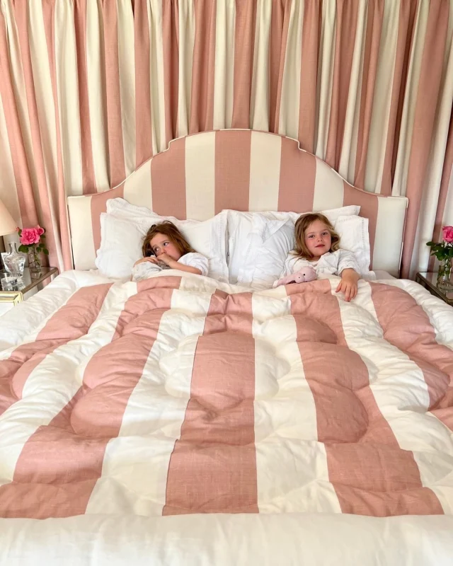 Eiderdowns have always been my bedroom signature style, sitting on top of a soft blanket and pretty-edged flat sheet. Probably because I love fabric draped around the bed and the feeling of being cocooned. Cosier and all the better when filled with little people! 

Eiderdown and matching bed curtain shown here are both in Arthur Stripe Rose Dust.

Available to order info@cinny.co.uk